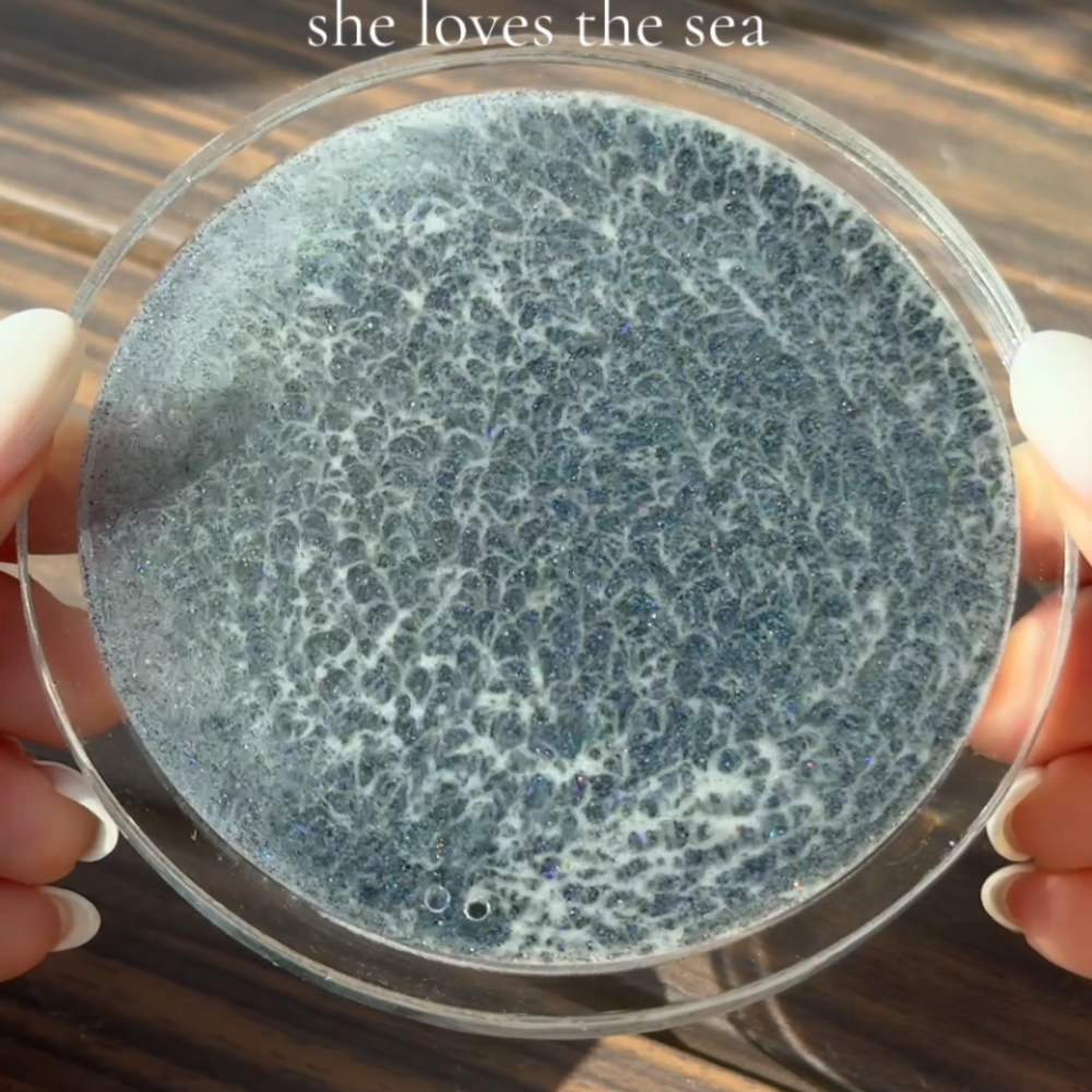 Ocean Tide handheld close-up showing its intricate foam-like wave pattern