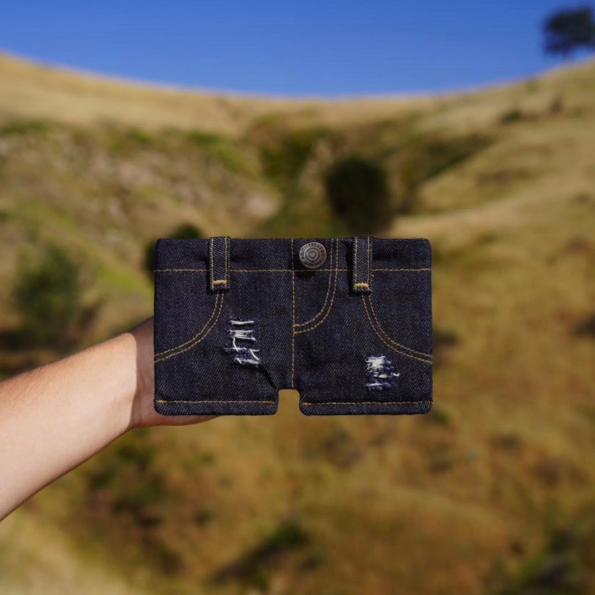 Shorts-style denim wallet in Ripped Denim