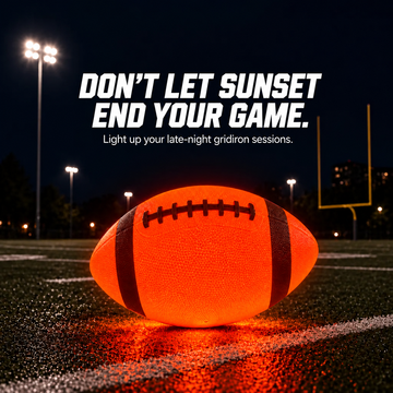 NightPass orange LED football glowing on an outdoor field at night